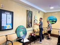 Mark Wygonik & Adam Conard installing Art In Public Places at Administration Building B