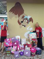 Gallery Image Seth_and_Hunter_delivering_gifts_to_a_Hope_for_Families_party.JPG