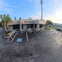 Before photo of Plant City Chamber parking lot showing faded markings prior to Radiant Striping restriping