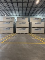Interior warehouse floor marking layout around stacked containers at 1-800-PACK-RAT Tampa