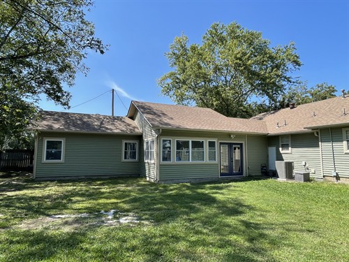 Large addition added to existing home in Bryant, AR. Includes a sunroom, living room, full kitchen, full bathroom with freestanding tub and walk in tile shower, bedroom, and laundry room. 