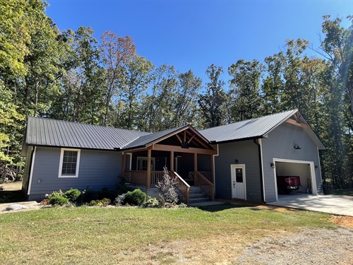 Fully renovated home in Hensley, AR. Included an extra large two car garage on the front of the home and large vaulted sunroom in the rear of the home. New metal roofing, Hardie siding, TREX deck, hardwood flooring, renovated kitchen and pantry, and various other renovations for a full face lift. 