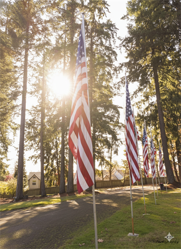 Groundskeeper put up flags for Veterans Day 