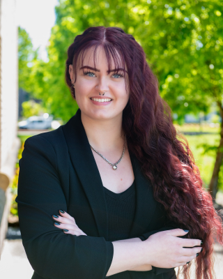 Headshot at client's location outdoors.