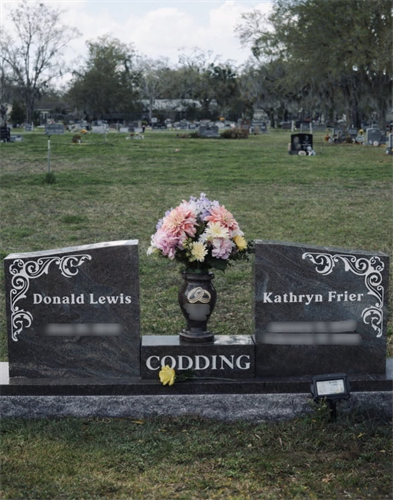 Companion monument with custom engraving and decorative detailing, designed to honor a shared legacy.