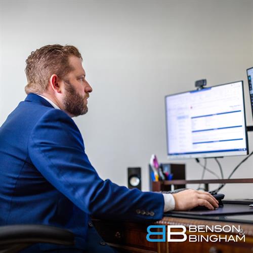 Inside Benson & Bingham’s Downtown office, attorney Jordan Kingsley focuses on his work, reviewing details for ongoing personal injury cases