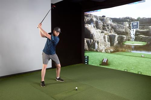 Hitting in Golf Simulator Bay