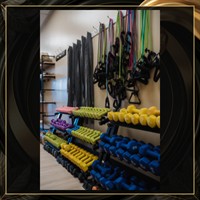 Colorful dumbbells and resistance bands in Vitara's renovated studio.
