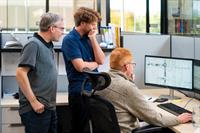 Engineers reviewing project drawings