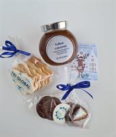 Festive gift set includes handmade caramel jar, cookies with chocolate edible company logo and Belgian chocolates.