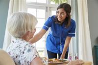 Gallery Image care-nurse-serving-dinner-to-a-senior-woman-at-hom-2023-11-27-05-33-45-utc.jpg