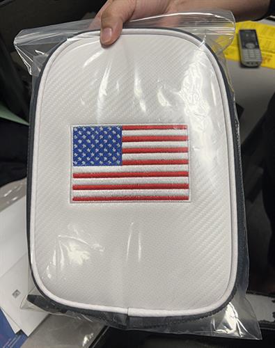 Golf bag - ball pocked cover embroidered US flag. Names also embroidered.
