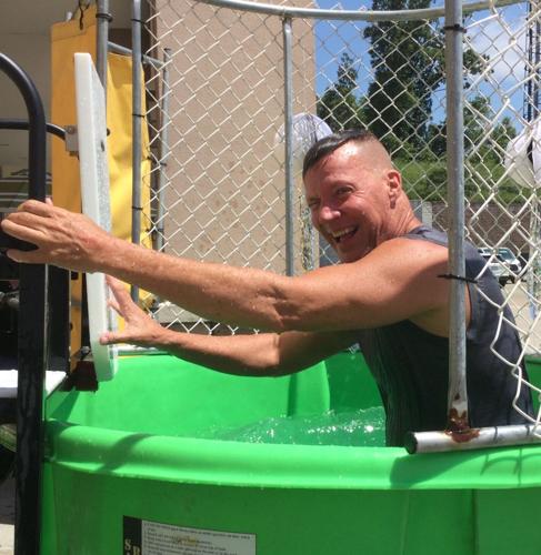 CEO Frank Archer in a dunk tank at a company event