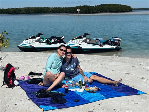Couple enjoying a scenic picnic at Shell Key Preserve on their private, guided tour