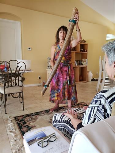 Marchia with a rainstick at her Sound Healing Workshop