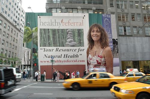 Marchia our copub and radio host super imposed in NY on Billboard