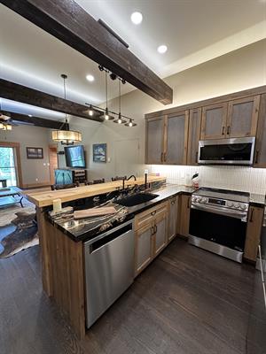 Full interior remodel, custom interior design, custom kitchen with custom barnwood cabinets.