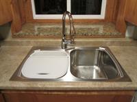 Gallery Image Stainless_steel_sink_with_Moen_Arbor_with_motion_sensor_faucet.jpg