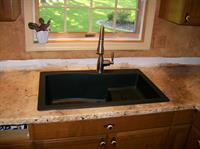 Gallery Image Swan_stone_kitchen_sink_with_Moen_faucet.jpg