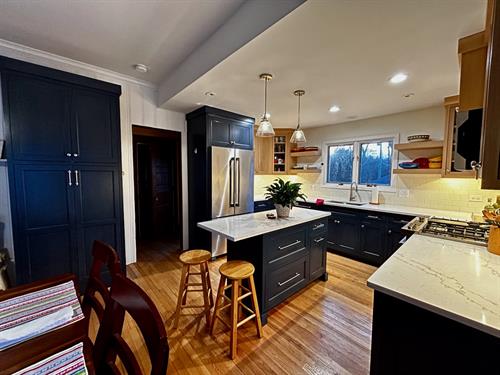  Full kitchen renovation with custom cabinets. A wall was also removed.