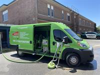 SERVPRO of West Pensacola using a truck mounted water extraction system for a commercial property that flooded.