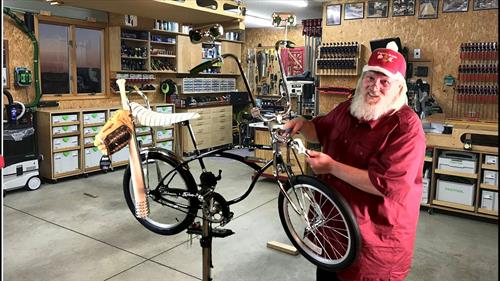 Santa building a Christmas Bicycle for Little Johnny who has been a very good boy this year.