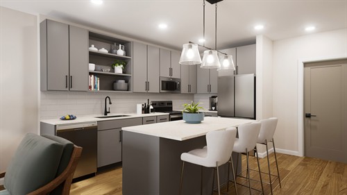 Spacious modern kitchen layout complete with a large island, sleek countertops, and designer lighting.