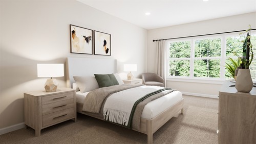 Bright and airy primary bedroom offering a sophisticated retreat with large windows and plush finishes.