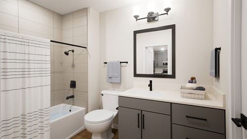 Spa-inspired bathroom featuring elegant contemporary tilework, a modern vanity, and premium fixtures.