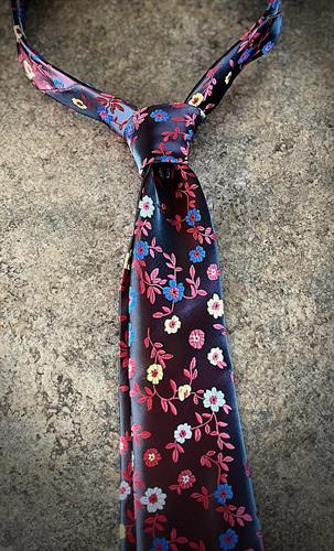 Fashionable necktie with a floral theme that can be worn to any event or for any occasion