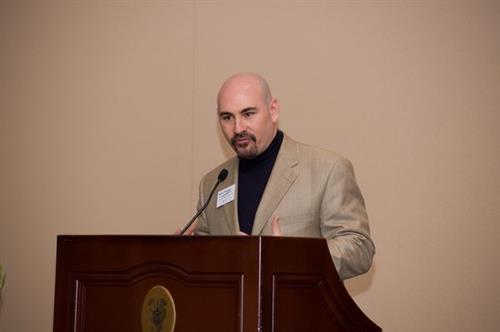 Presenting at ARCOS annual meeting in San Francisco at podium