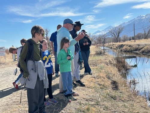 CFF Board Secretary Chris Leonard teaching kids about reading the water