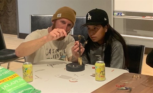 Luke Kinney helping Wovoka Martinez