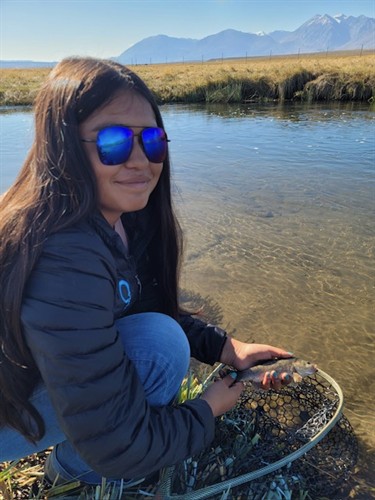 Turquise Stone with a trout caught and released on the Upper Owens