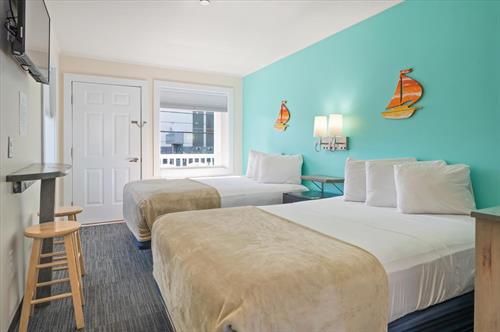 Guest room with 2 full size beds in the new building at Beach Bum Inn