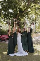 Bridal party portrait by the chandelier tree Bridal party portrait by the chandelier tree