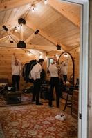 Groomsmen getting ready in the forest lounge Groomsmen getting ready in the forest lounge