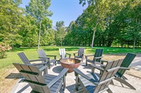 Gather around the private fire pit for evenings under the trees at Copper Top Ridge in Harbor Country.
