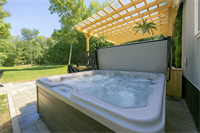 Private hot tub surrounded by the peaceful wooded setting of Copper Top Ridge in New Buffalo.
