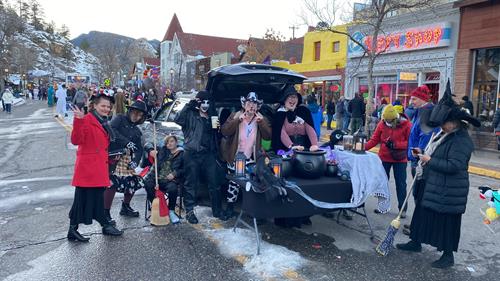 Passing out candy in downtown Estes Park on Halloween 