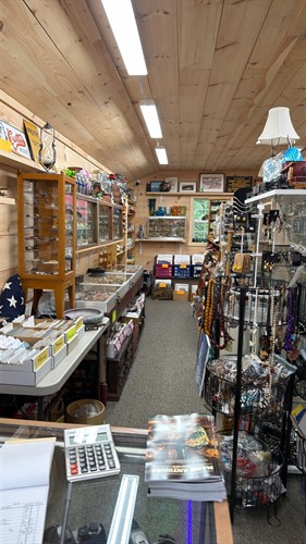 We also carry vintage knives, old signs, Fenton and Blenko glass and miniatures.