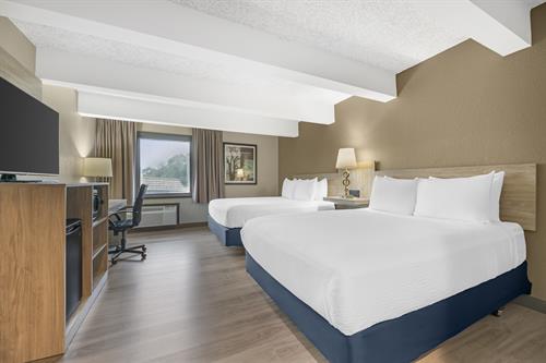 Our guest rooms are designed with your comfort in mind, featuring options such as two double beds, two queen beds, or one king bed.