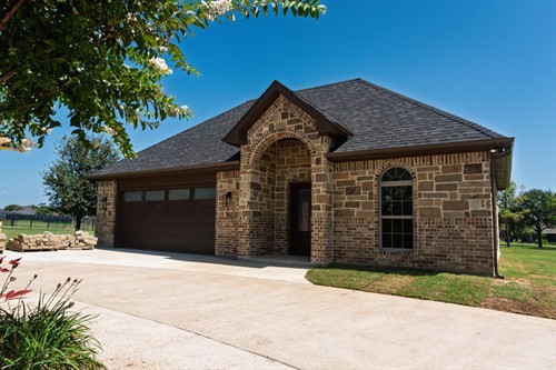 Conditioned accessory garage with man cave addition.