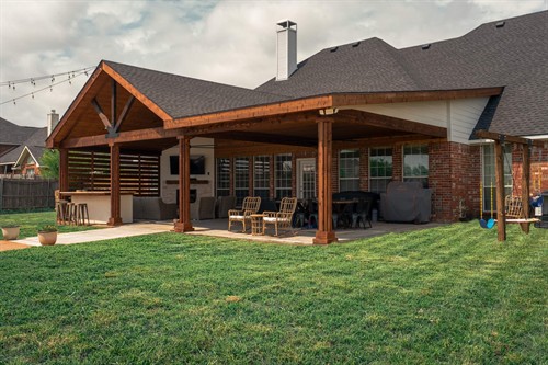 Attached cedar patio cover with a big gable end.