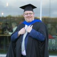 Paul holds Waterford and SETU Master’s degree in his pocket