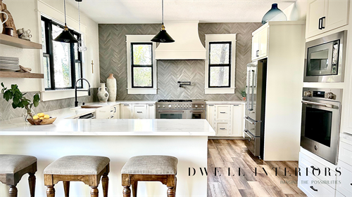 From the crisp white cabinetry to the natural wood accents and neutral tones, this updated farmhouse kitchen is a true masterpiece. Every detail has been carefully curated to create a welcoming and inspiring environment where memories are made and delicious meals are prepared.