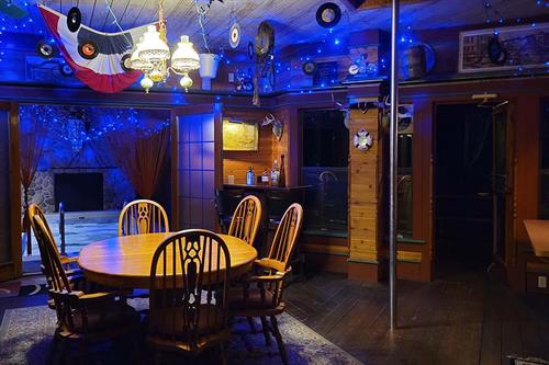 Gallery Image Adeline's_House_of_Cool_2nd_dining_area_with_firemans_pole_at_night.jpg