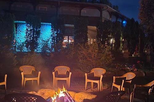 Gallery Image Adeline's_House_of_Cool_fire_pit_at_night.jpg