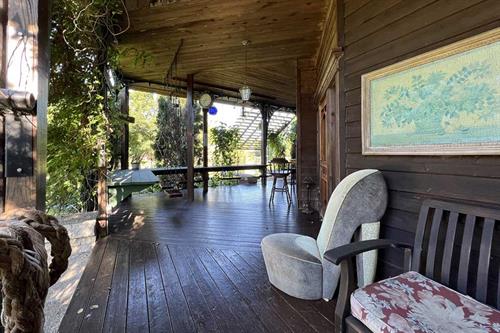 Gallery Image Adeline's_House_of_Cool_porch_fire_pit_pier_corner.jpg