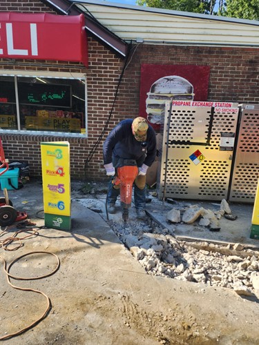 repairing a water service at the Amoco gas station in Pemberton